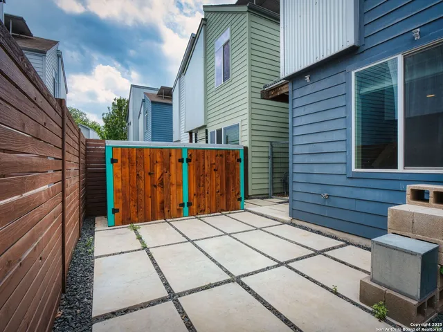 a view of a brick house with a street