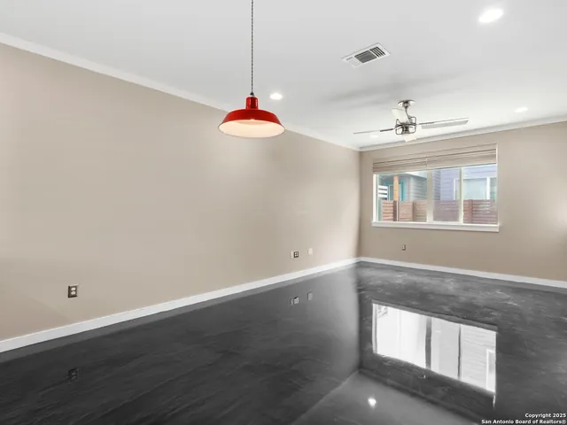 a view of an empty room with a window