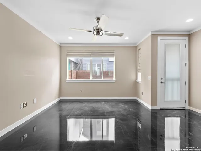 a view of an empty room with a window