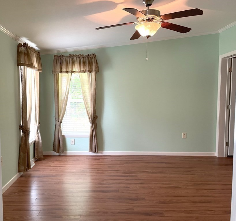 15 2nd Street Merrimac, MA 01860 - Photo 11 of 31 an empty room with wooden floor fan and windows