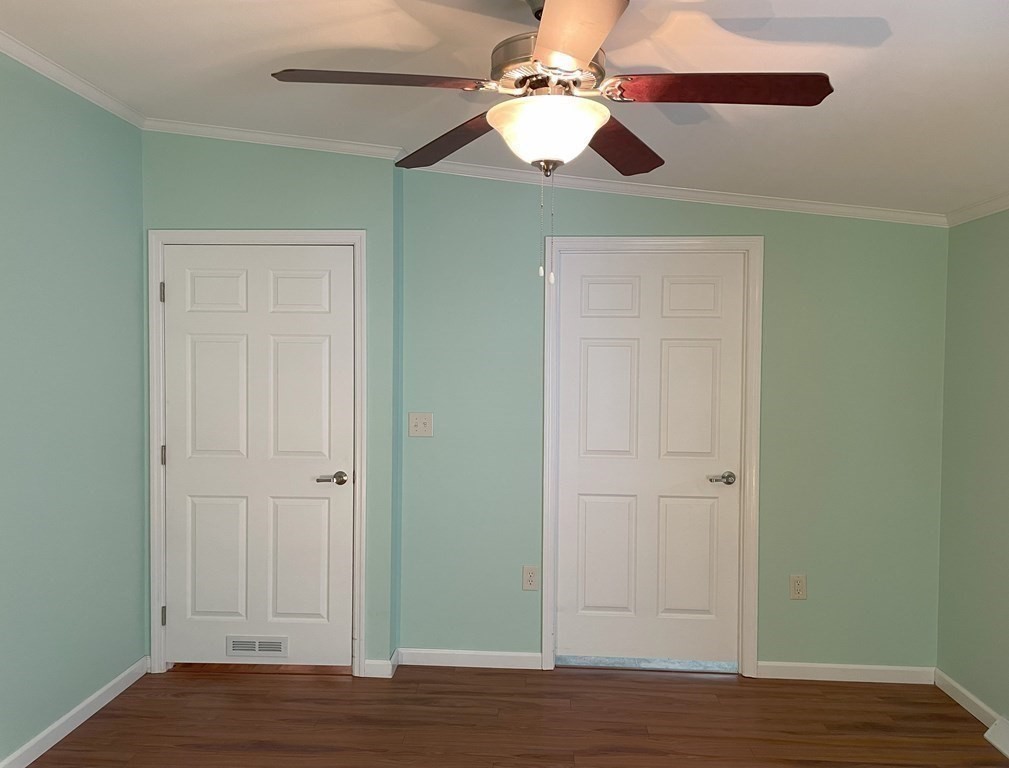 15 2nd Street Merrimac, MA 01860 - Photo 12 of 31 an empty room with wooden floor closet and fan