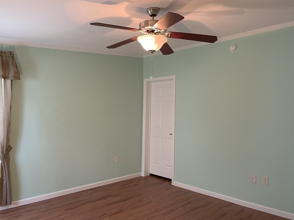 15 2nd Street Merrimac, MA 01860 - Photo 13 of 31 an empty room with wooden floor fan and windows