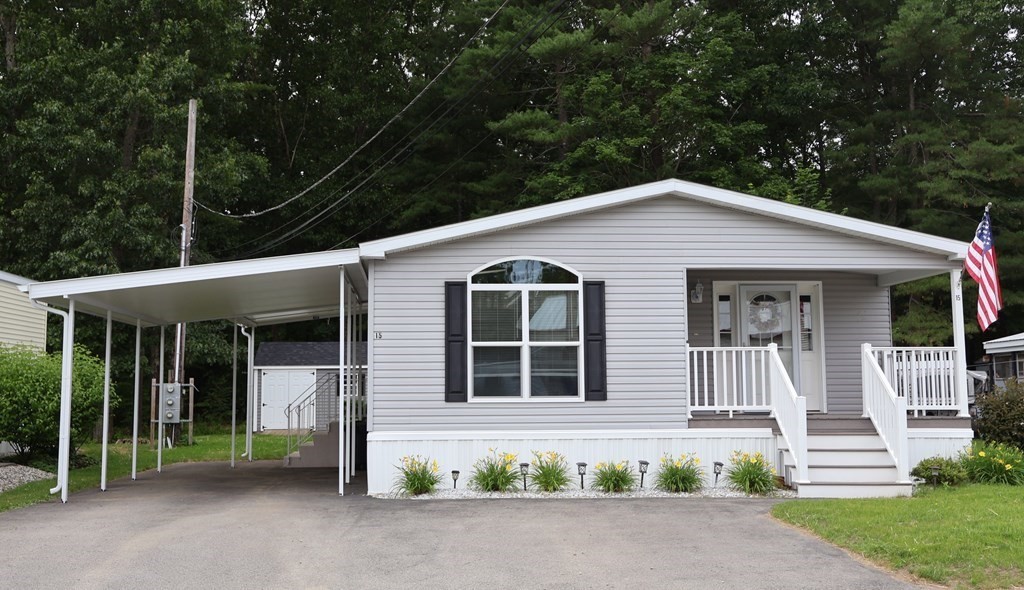 15 2nd Street Merrimac, MA 01860 - Photo 2 of 31 a front view of a house with a garden and yard