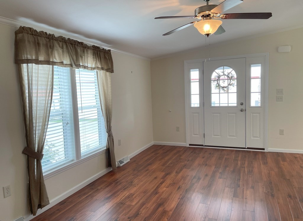 15 2nd Street Merrimac, MA 01860 - Photo 8 of 31 an empty room with wooden floor fan and windows