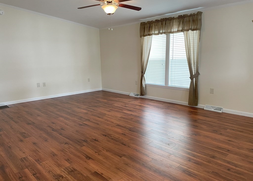 15 2nd Street Merrimac, MA 01860 - Photo 9 of 31 an empty room with wooden floor and windows
