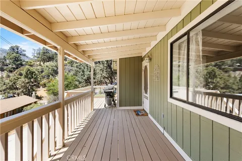 a view of a balcony with wooden floor