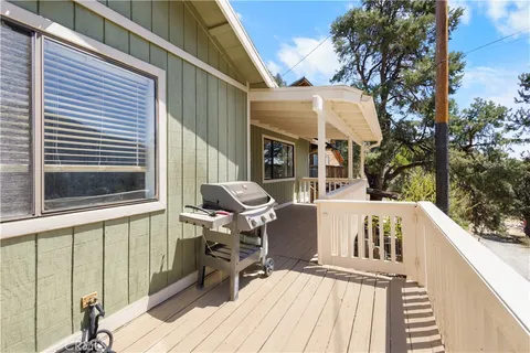 a view of balcony with two chairs and a table