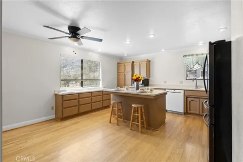 a kitchen with a sink appliances and cabinets