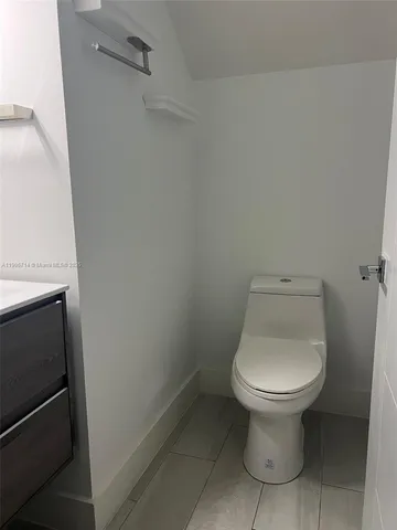 a bathroom with a toilet and a sink