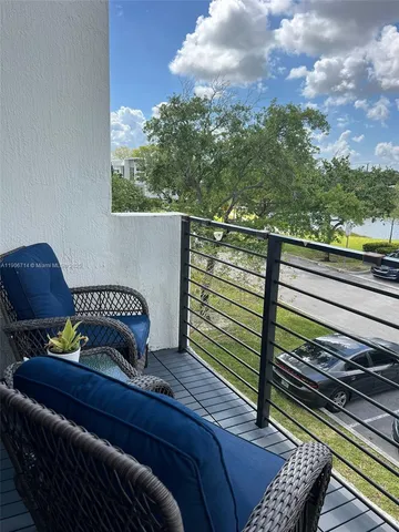 a view of a house with a yard porch and sitting area