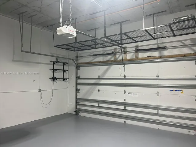 a living room with furniture and large windows