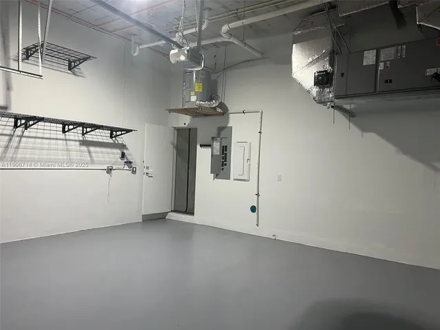 a bed room with a bed and a chandelier