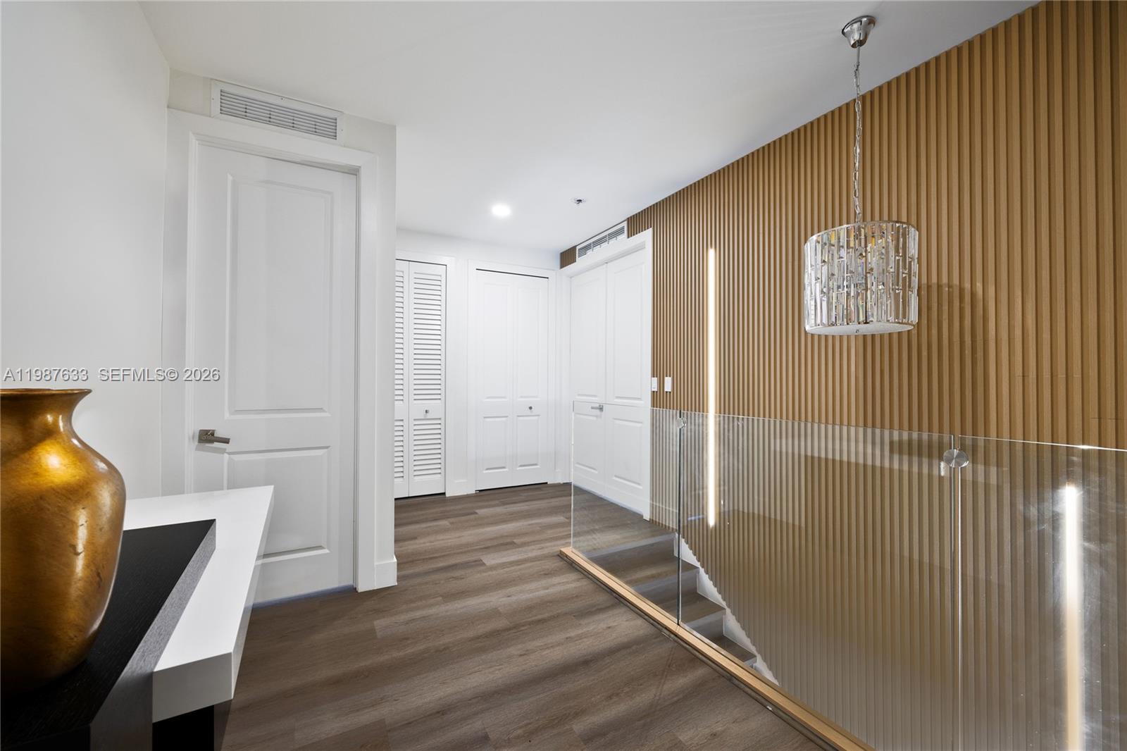 2981 Southwest 149th Avenue Miami, FL 33185 - Photo 17 of 30 a view of a hallway with wooden floor