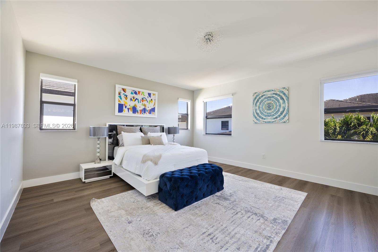 2981 Southwest 149th Avenue Miami, FL 33185 - Photo 18 of 30 a spacious bedroom with a bed and a wooden floor