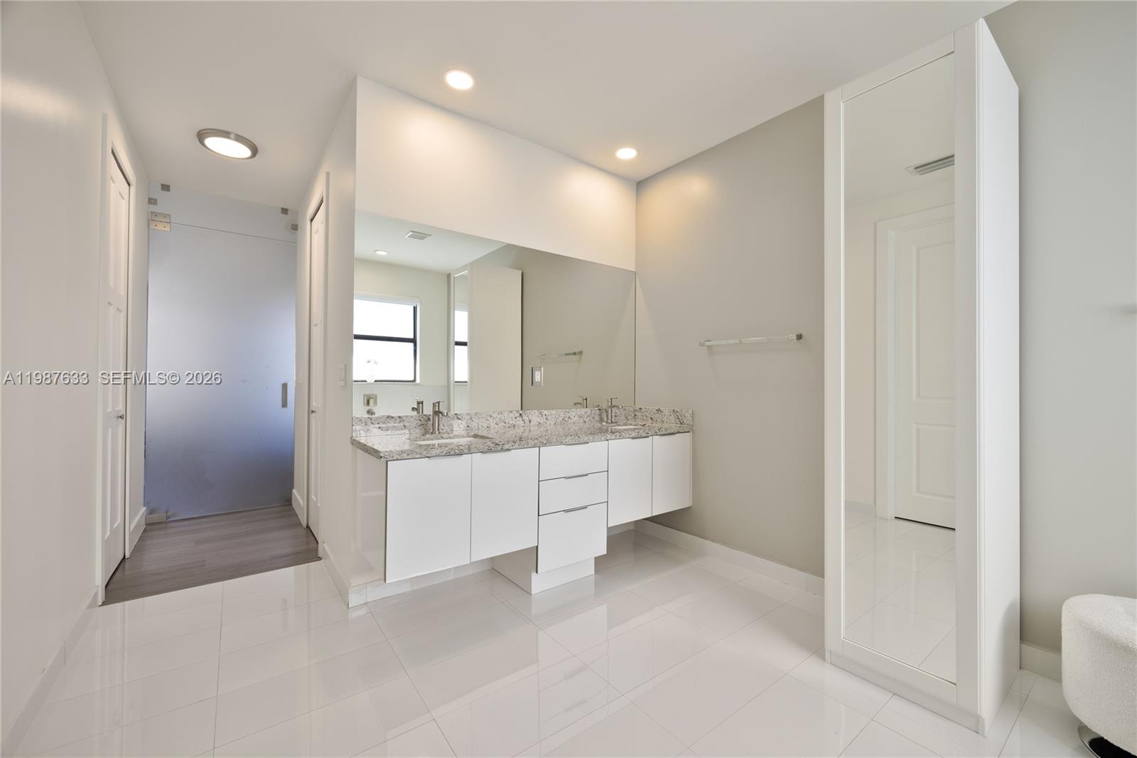 2981 Southwest 149th Avenue Miami, FL 33185 - Photo 19 of 30 a bathroom with a granite countertop sink mirror and bathtub