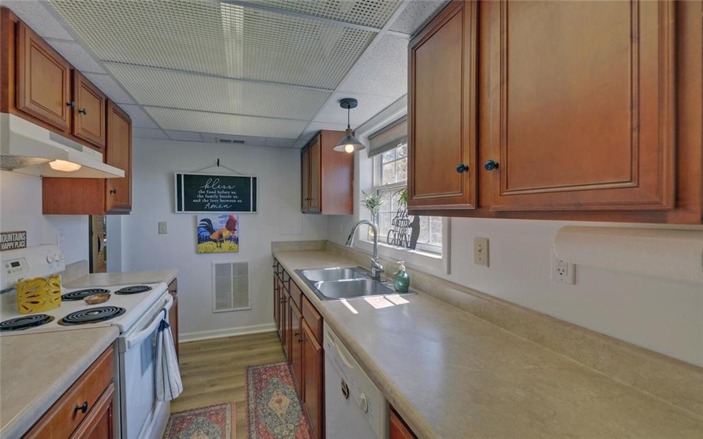 1492 Ivy Mountain Road Clarkesville, GA 30523 - Photo 11 of 53 a kitchen that has a sink and a stove in it