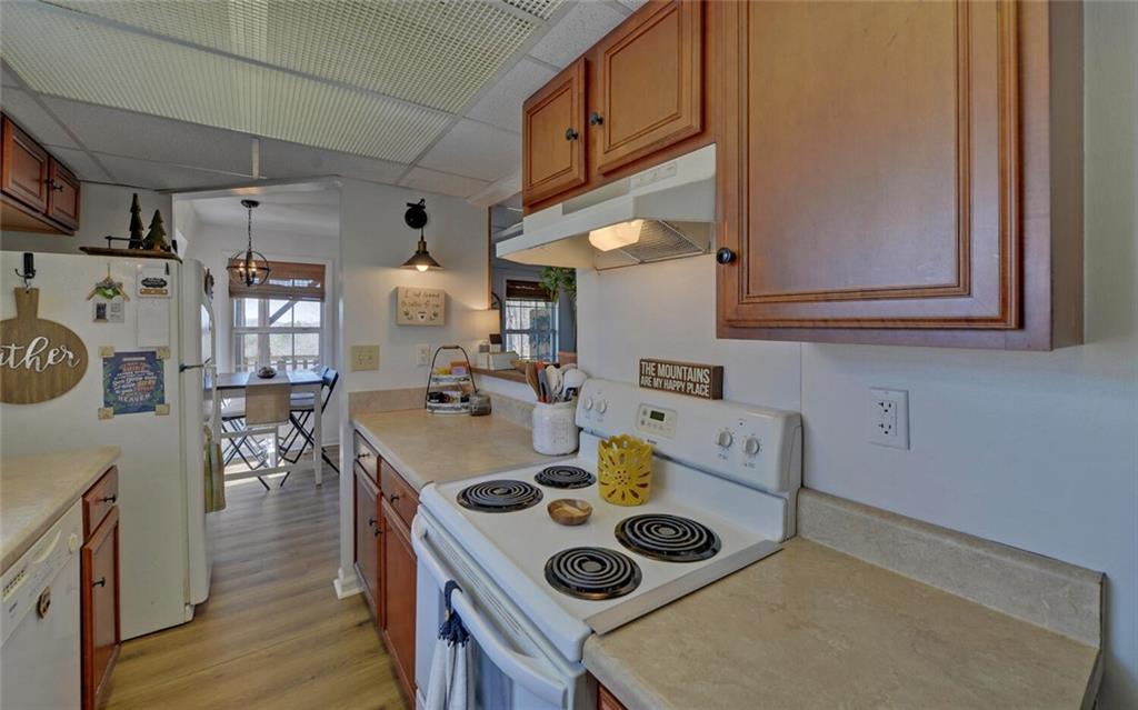1492 Ivy Mountain Road Clarkesville, GA 30523 - Photo 13 of 53 a table and chairs in a kitchen