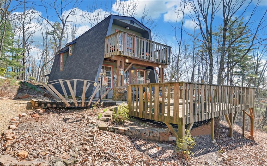 1492 Ivy Mountain Road Clarkesville, GA 30523 - Photo 36 of 53 a view of a house with a yard