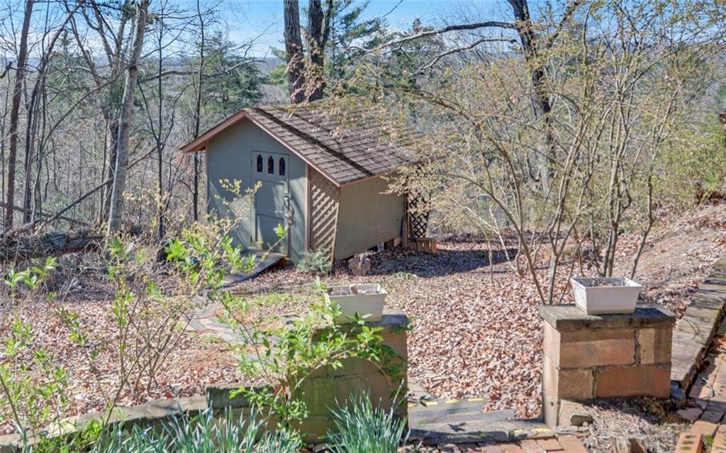 1492 Ivy Mountain Road Clarkesville, GA 30523 - Photo 38 of 53 a front view of a house with garden