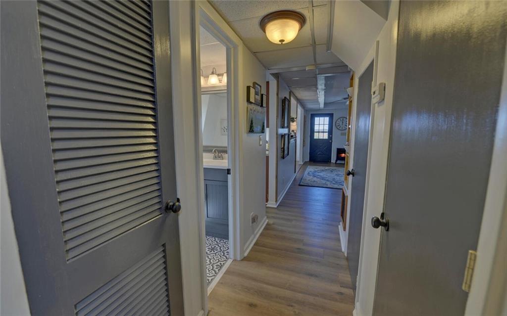 1492 Ivy Mountain Road Clarkesville, GA 30523 - Photo 5 of 53 a view of a hallway with wooden floor