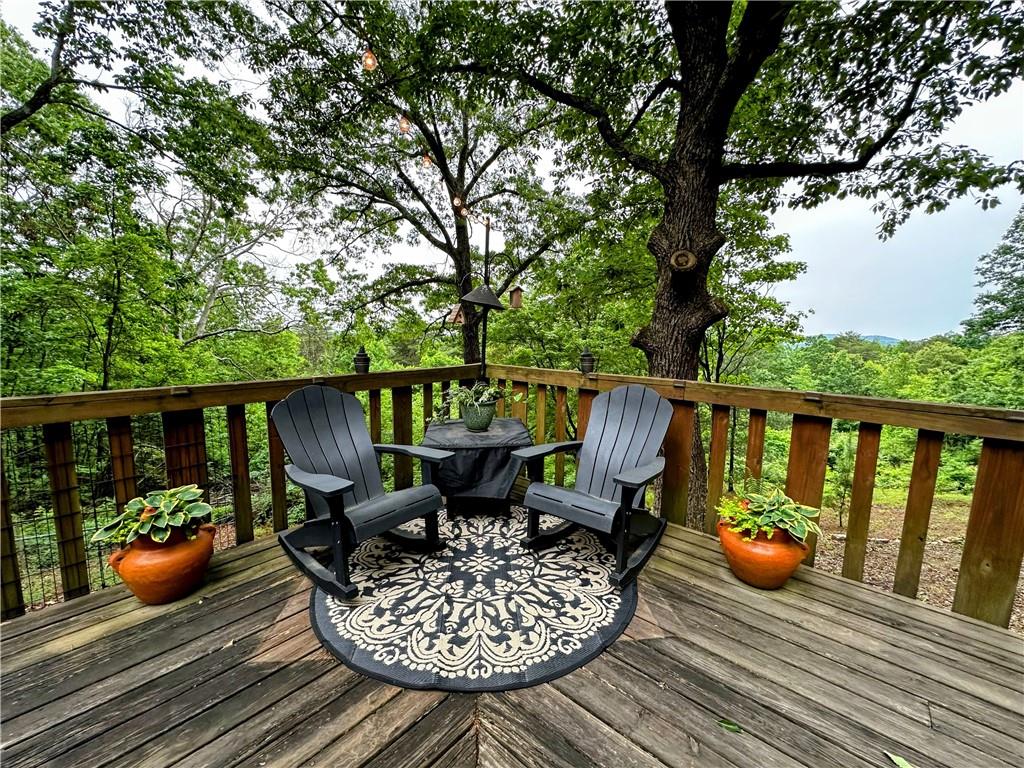 1492 Ivy Mountain Road Clarkesville, GA 30523 - Photo 52 of 53 a view of balcony with wooden floor and outdoor seating