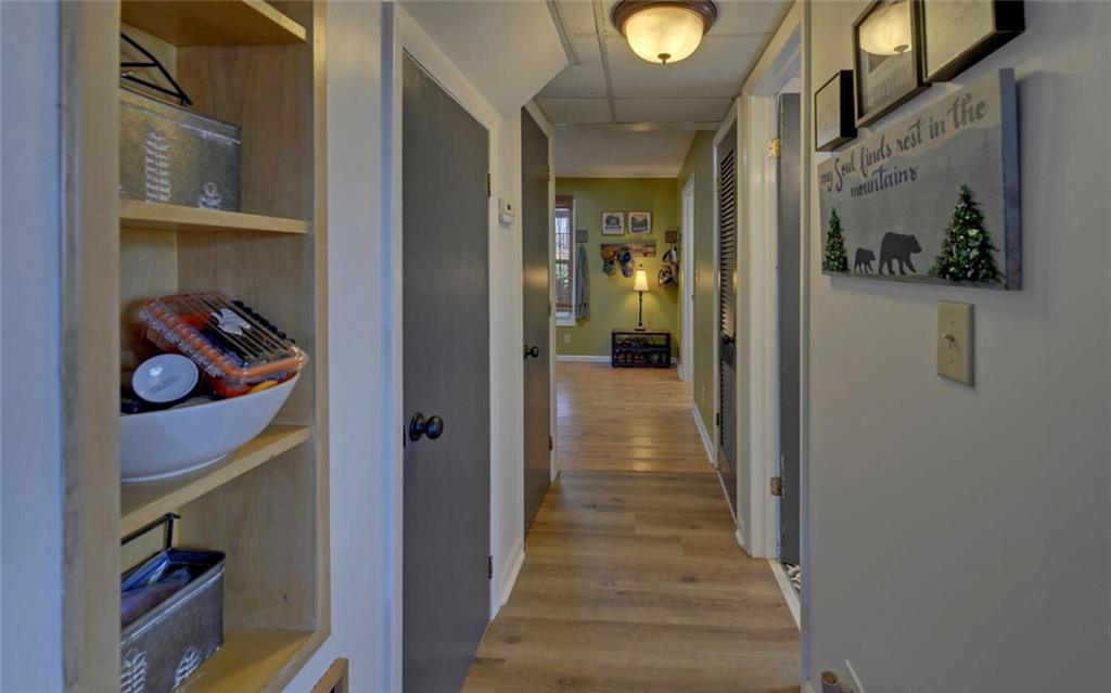 1492 Ivy Mountain Road Clarkesville, GA 30523 - Photo 6 of 53 a view of a hallway with wooden shelves