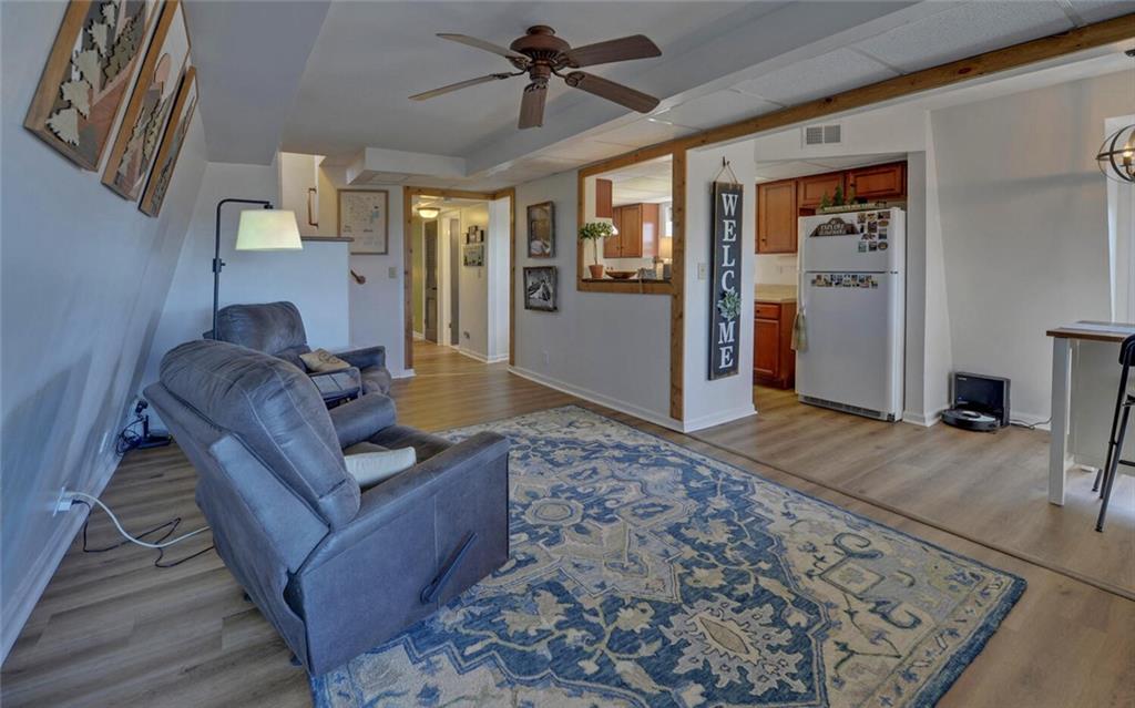 1492 Ivy Mountain Road Clarkesville, GA 30523 - Photo 10 of 53 a living room with furniture and a rug