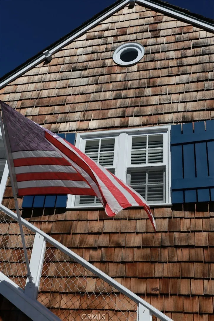 28 Beacon Bay Newport Beach, CA 92660 - Photo 3 of 15 a front view of a house with a yard