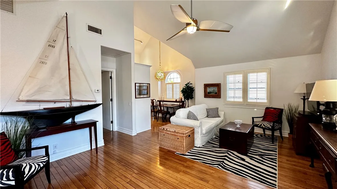 28 Beacon Bay Newport Beach, CA 92660 - Photo 4 of 15 a living room with furniture and a wooden floor