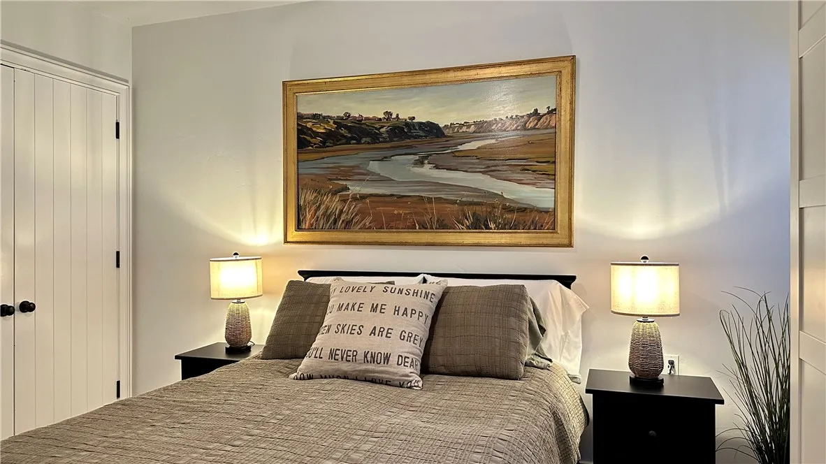 28 Beacon Bay Newport Beach, CA 92660 - Photo 8 of 15 a bedroom with a bed and wooden floor