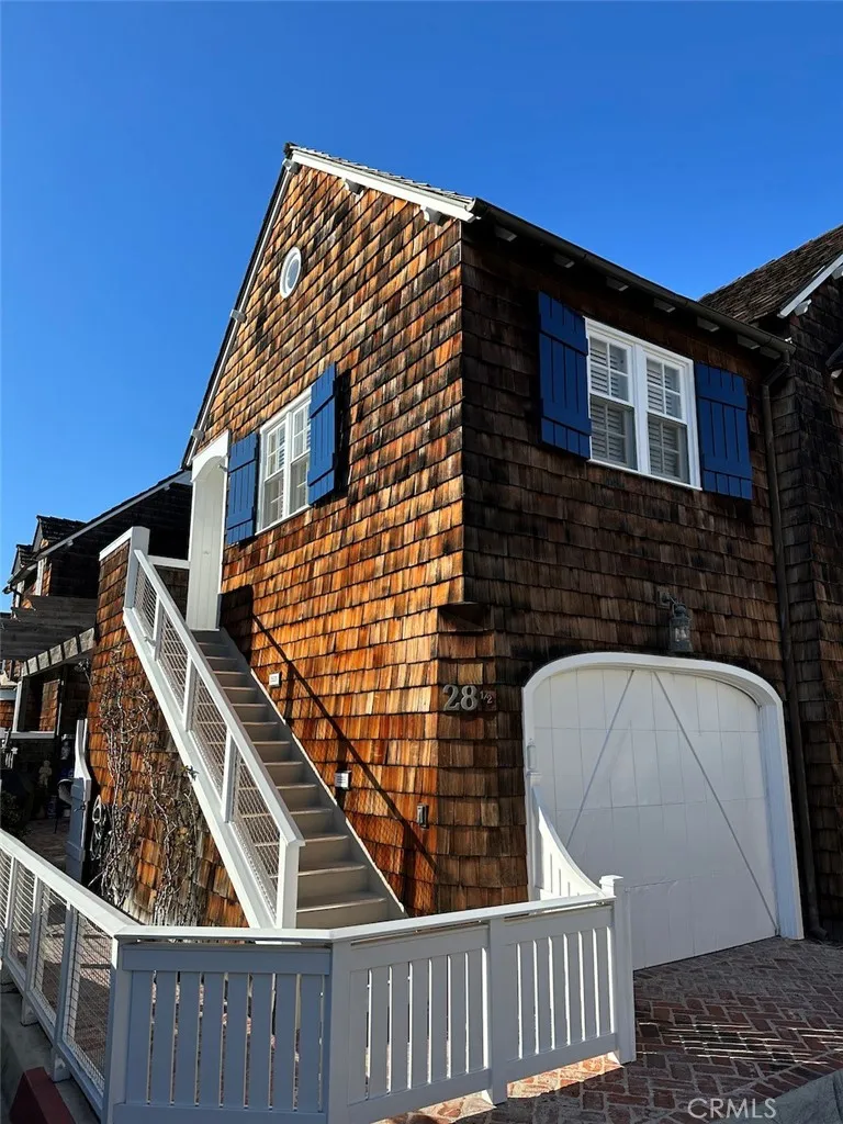 28 Beacon Bay Newport Beach, CA 92660 - Photo 10 of 15 a front view of a house with parking space