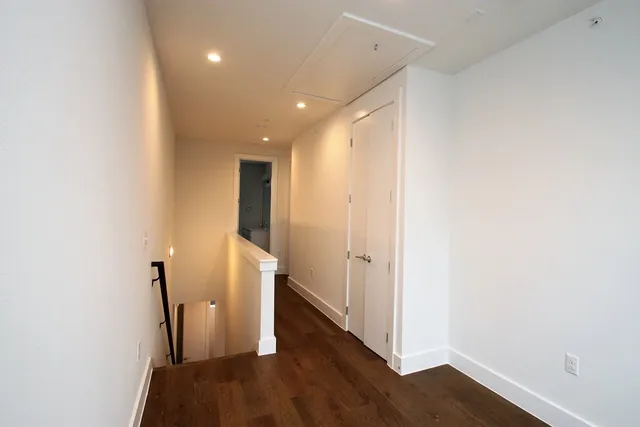 a view of a hallway with painted walls