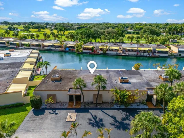 an aerial view of a house with outdoor space