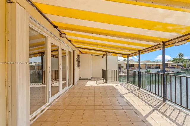 a view of a balcony with wooden floor