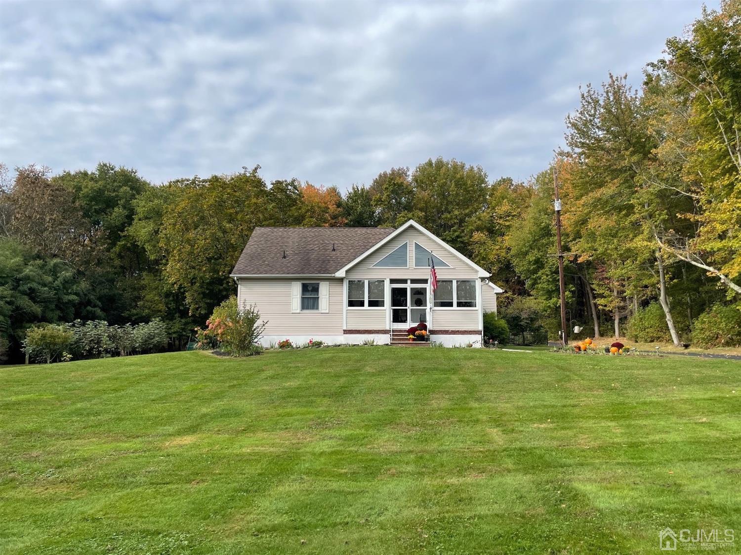 234 Morganville Road Old Bridge, NJ 07747 - Photo 1 of 52 a front view of a house with a yard