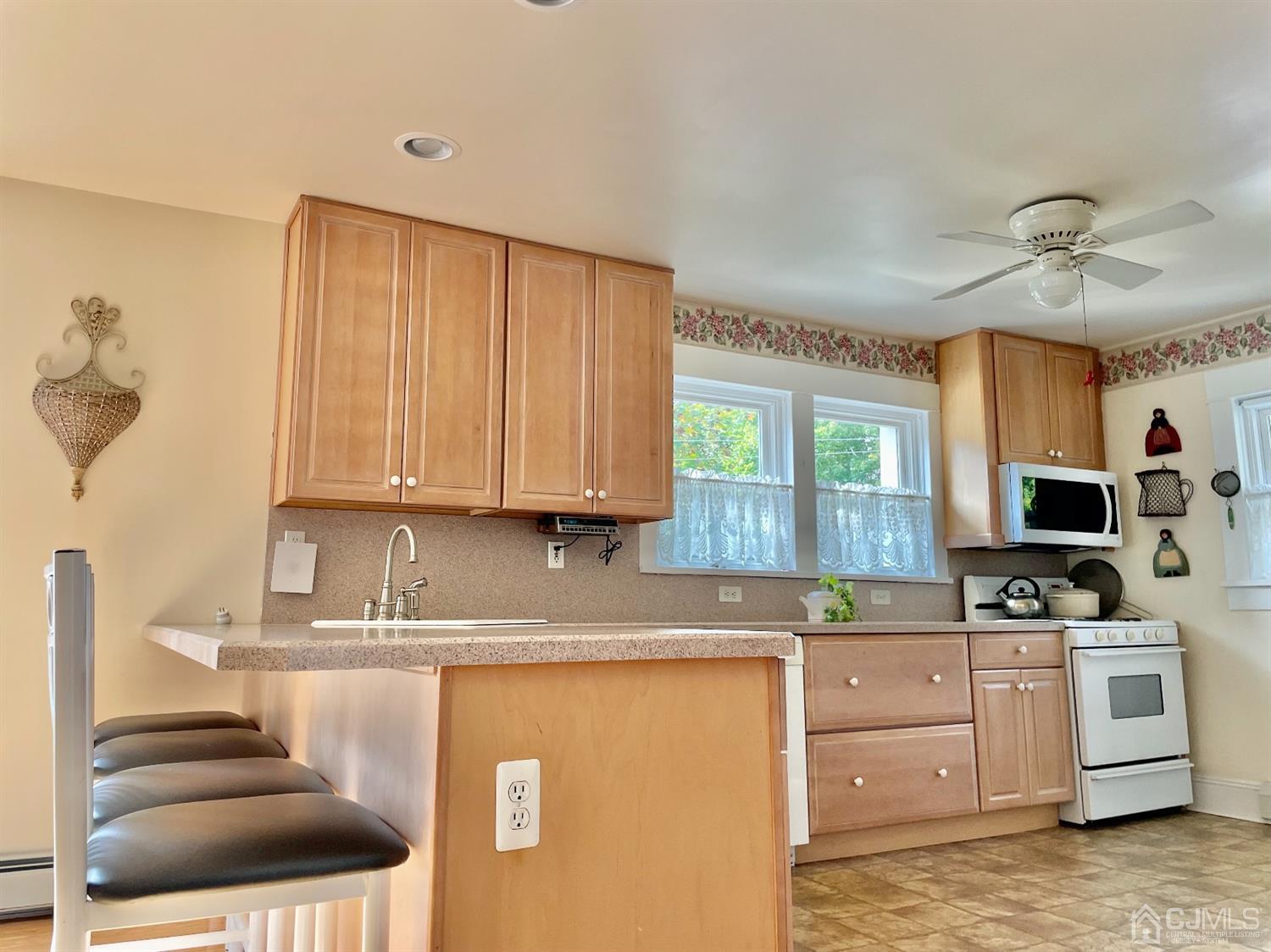234 Morganville Road Old Bridge, NJ 07747 - Photo 12 of 52 a kitchen with granite countertop a sink stainless steel appliances and cabinets