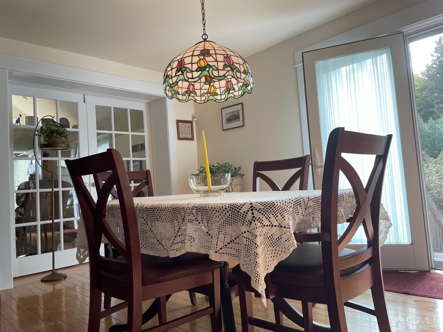 234 Morganville Road Old Bridge, NJ 07747 - Photo 19 of 52 a view of a dining room with furniture wooden floor and chandelier