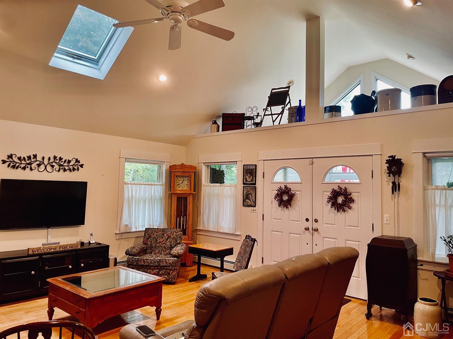 234 Morganville Road Old Bridge, NJ 07747 - Photo 22 of 52 a living room with furniture and a flat screen tv