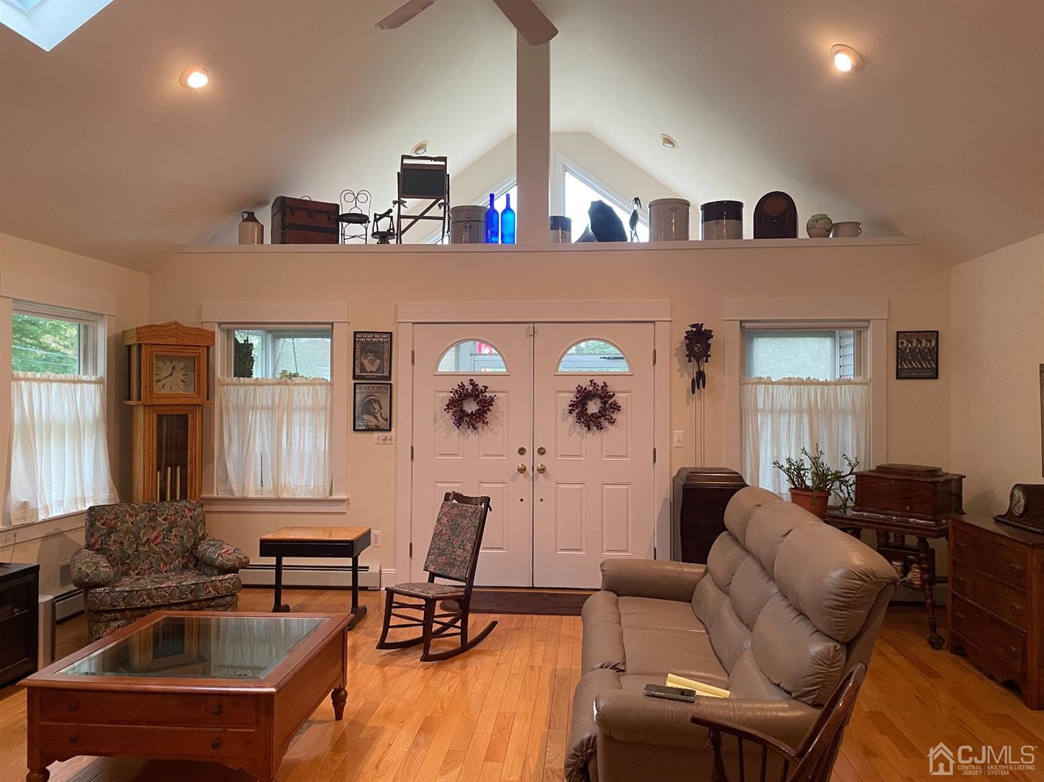 234 Morganville Road Old Bridge, NJ 07747 - Photo 23 of 52 a living room with furniture and a flat screen tv