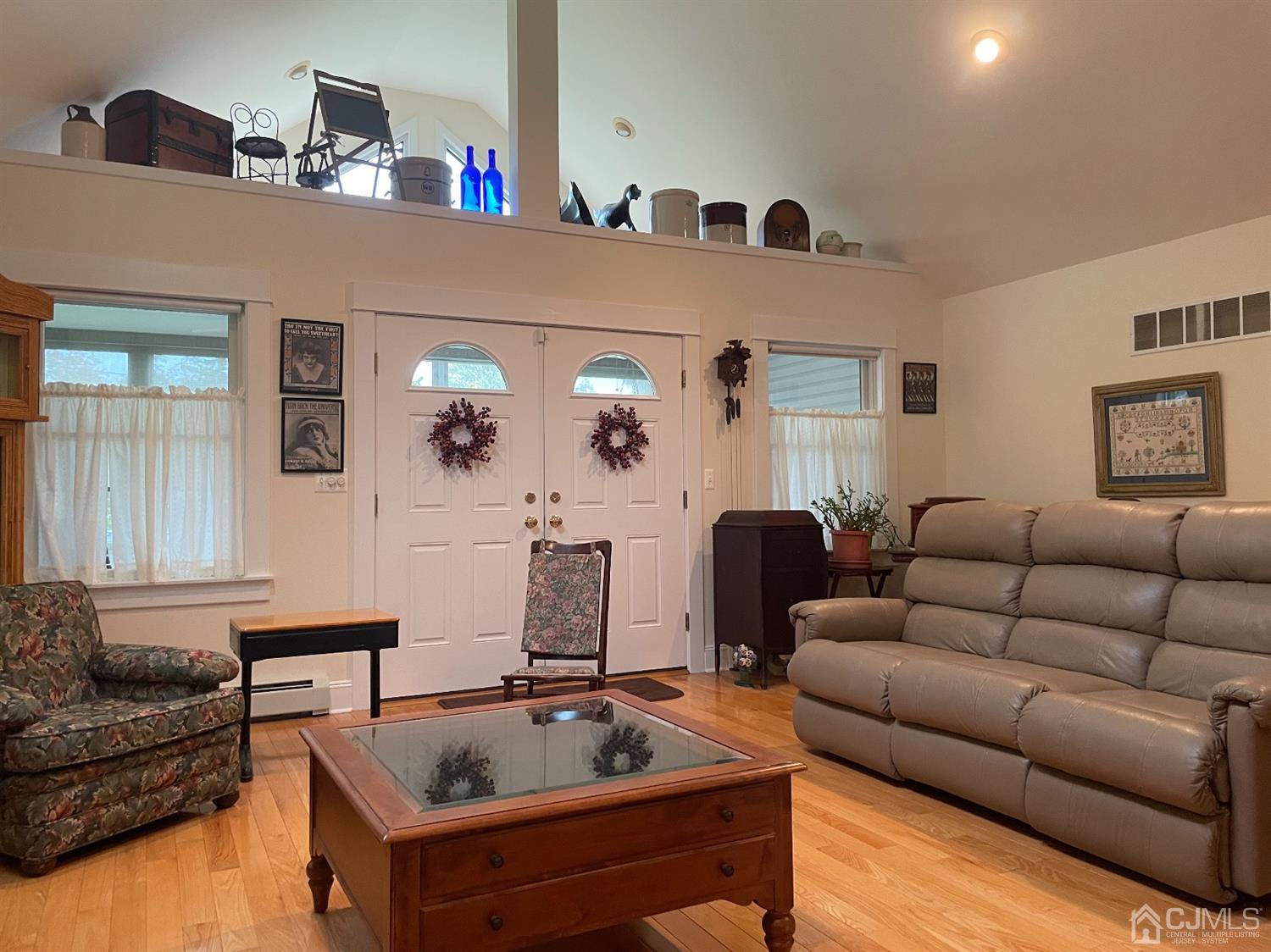 234 Morganville Road Old Bridge, NJ 07747 - Photo 25 of 52 a living room with furniture and a couch