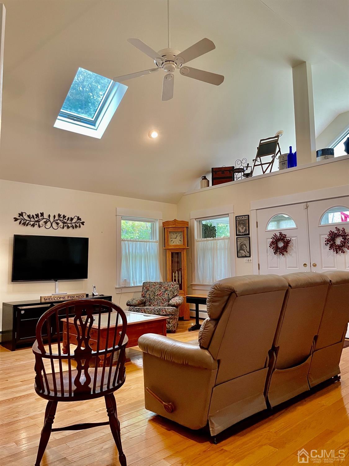 234 Morganville Road Old Bridge, NJ 07747 - Photo 26 of 52 a living room with furniture and a flat screen tv