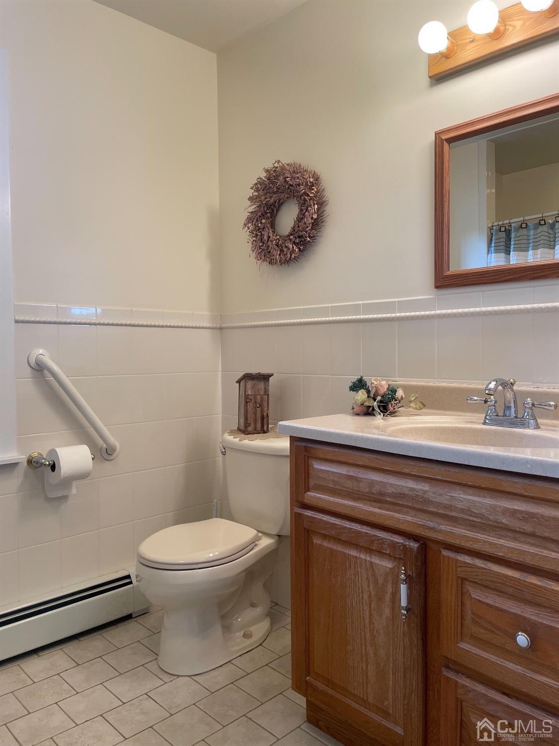 234 Morganville Road Old Bridge, NJ 07747 - Photo 27 of 52 a bathroom with a toilet sink and mirror