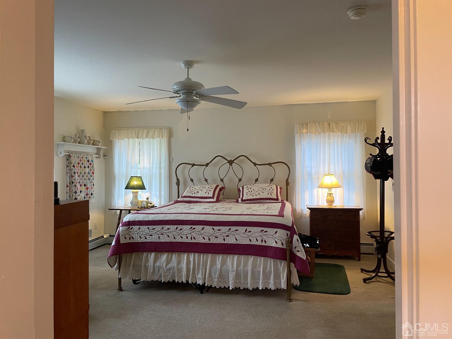 234 Morganville Road Old Bridge, NJ 07747 - Photo 29 of 52 a bedroom with a bed a chandelier and dresser