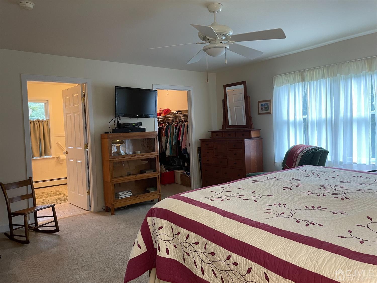 234 Morganville Road Old Bridge, NJ 07747 - Photo 30 of 52 a bedroom with a bed and a television in it