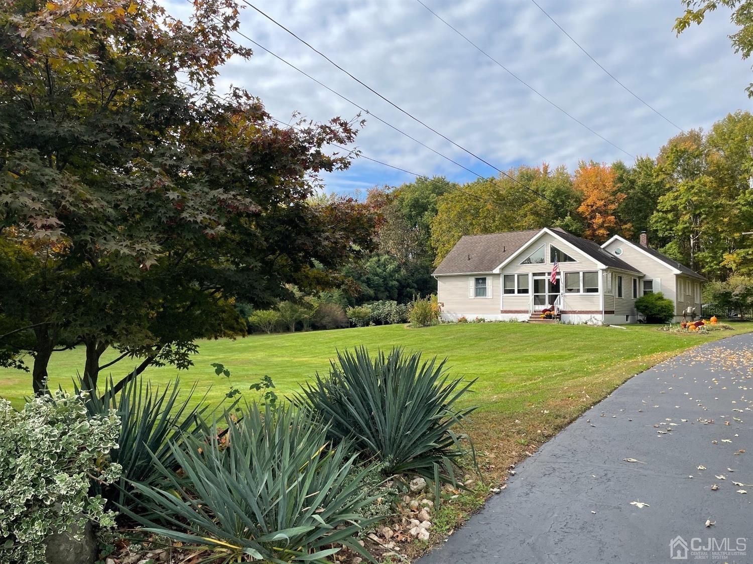 234 Morganville Road Old Bridge, NJ 07747 - Photo 4 of 52 a front view of a house with garden