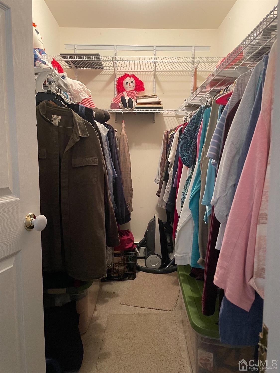 234 Morganville Road Old Bridge, NJ 07747 - Photo 31 of 52 a view of walk in closet with clothes and shoes