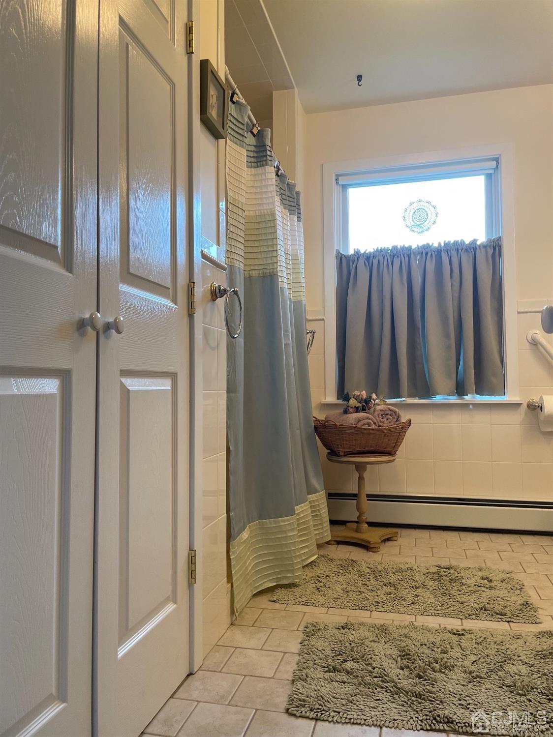 234 Morganville Road Old Bridge, NJ 07747 - Photo 32 of 52 a bathroom with a sink and a glass door
