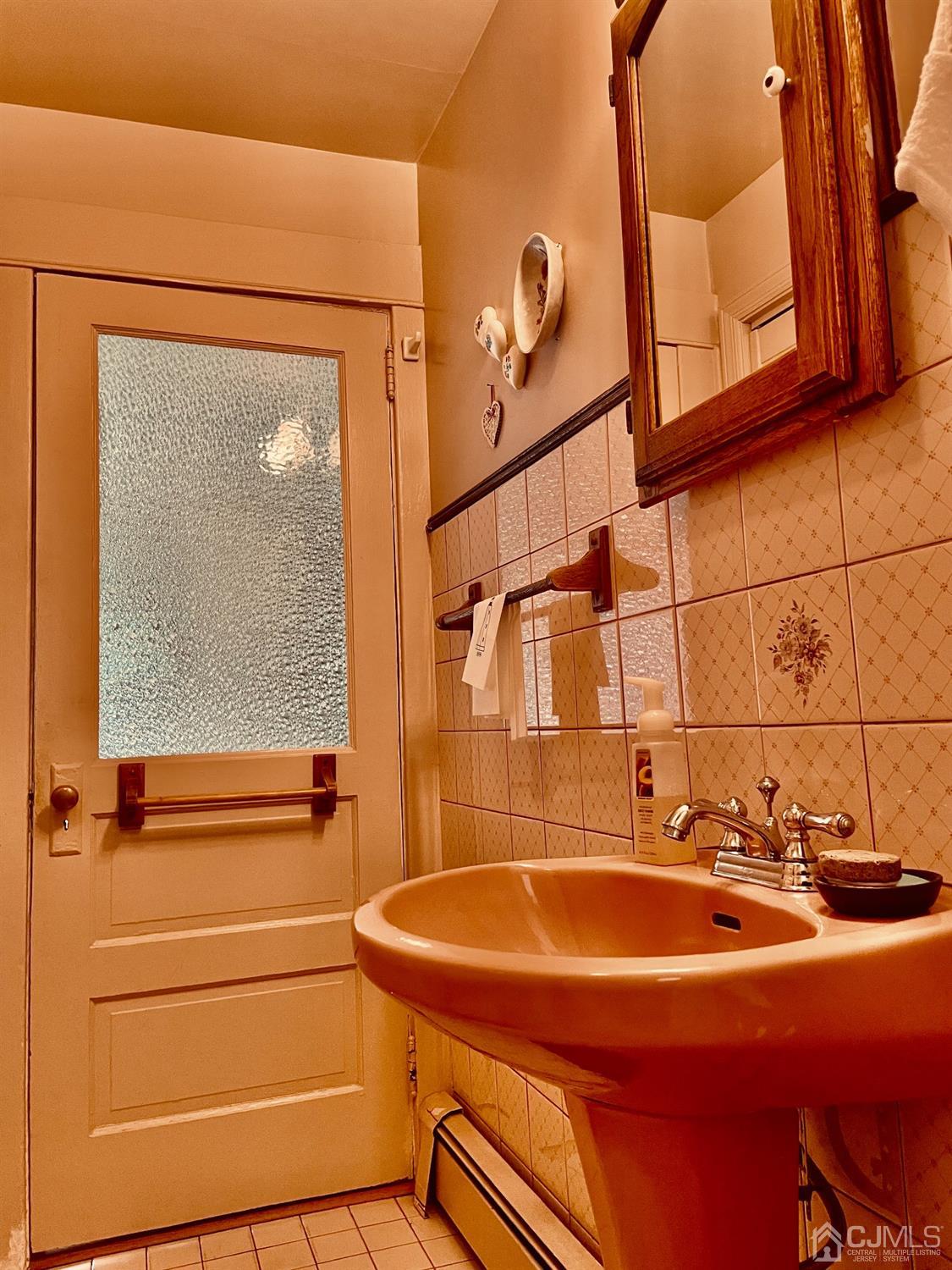 234 Morganville Road Old Bridge, NJ 07747 - Photo 37 of 52 a bathroom with a sink and mirror