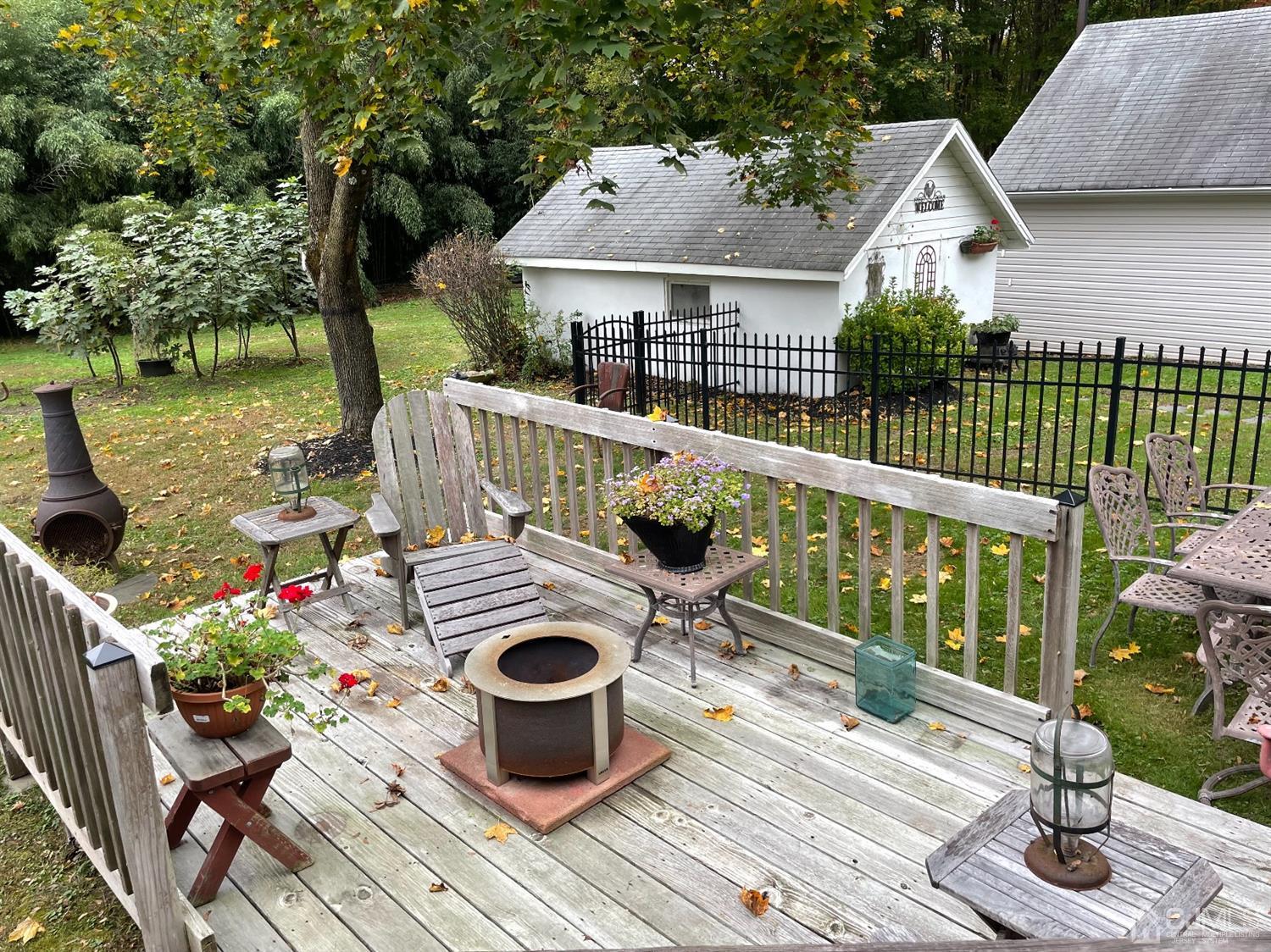 234 Morganville Road Old Bridge, NJ 07747 - Photo 47 of 52 a view of house with patio outdoor seating and green space