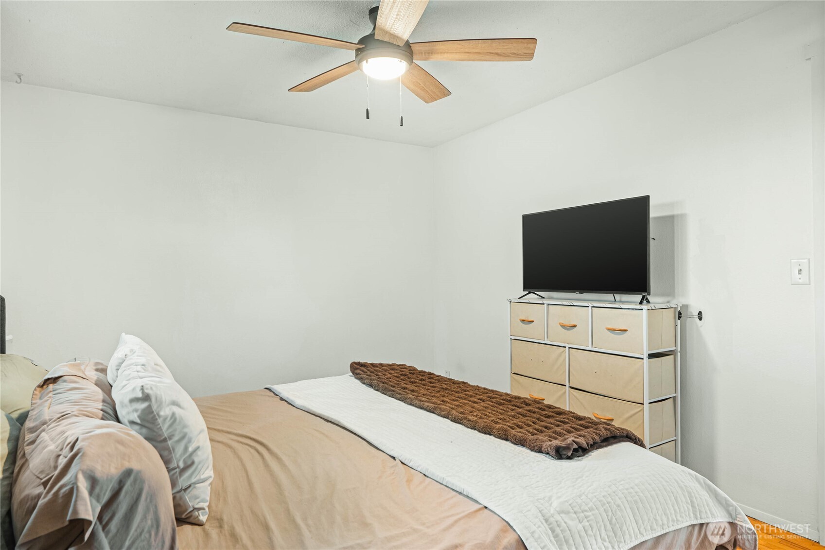 924 9th Street Southwest Puyallup, WA 98371 - Photo 23 of 38 a bedroom with a bed and a flat screen tv